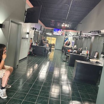 Marveliz Cutz interior view from the waiting area with barber stations